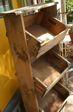 an old wooden crate is sitting on the porch