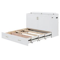 a white bed frame with drawers underneath it