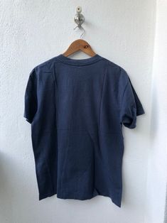 "PLEASE ASK ANY QUESTION BEFORE BUYING THIS IS USED CLOTHING PLEASE DONT EXPECTED IT TO BE LIKE NEW OR IN PRISTINE CONDITIONPLEASE REFER TO THE ACTUAL/MANUAL SIZE TAKEN Size on tag : M Condition : 8/10 Made : USA Color : Navy Blue/ Band Name Font/ Art Measurement : armpit to armpit= 20\"inches Lenght from top of the shoulder to bottom= 27\"Inches In a good vintage condition Vintage but still good and nice No tears No Stains and slightly faded due to it age and cracked printed (refer photo) World Blue Band Merch Top For Streetwear, Blue Band Merch T-shirt With Graphic Print, Faded Band Merch T-shirt, Blue Band Merch T-shirt, Vintage Blue T-shirt With Front Print, Font Art, Blue Band, Used Clothing, Mens Graphic Tee