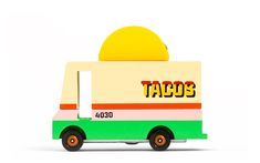 a taco truck with the word tacos on it