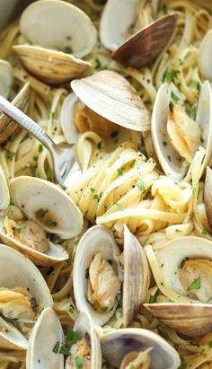 pasta with clams and sauce in a pan