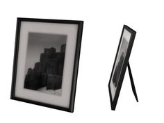 a black and white photo next to a framed photograph