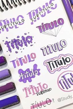 some type of stickers are on top of a spiralle notebook with markers and pens