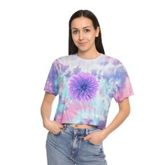 This icon of the 60s is back with a beautiful violet Dahlia flower printed on the front and back.  Made with 60% cotton and 40% polyester, this tee balances perfectly between comfy and stretchy, making it an excellent all-around choice for casual wearing. Each tee comes pre-shrunk for no size-related surprises after repeated washes, and features a drop shoulder sleeve for laid-back vibes.  .: 60% Cotton 40% Polyester .: Light fabric (5.4 oz/yd² (183 g/m .: Relaxed fit .: Sewn-in label Because this t-shirt is custom printed for your size, there are no returns or exchanges.  Please contact us with any issues. .: Shirt colors and pattern may vary Trendy Tie Dye Crop Top For Spring, Hippie Cropped Tops For Spring, Spring Tie-dye Tops With Watercolor Print, Spring Tie Dye Top With Watercolor Print, Tie-dye Cropped Cotton Tops, Tie Dye Short Sleeve Crop Top For Summer, Spring Tie Dye Cropped Crop Top, Cropped Tie Dye Cotton Tops, Casual Tie Dye Crop Top For Spring