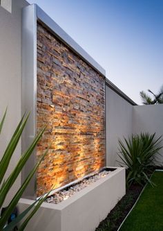 an outdoor water feature in a modern backyard