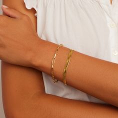 Description Stay stacked! Two perfectly paired bracelets instantly elevate any outfit. Product Details Parker Bracelet Total length 7 1/4" Links measure 3/8" by 1/8" Hinge closure measures 1/2" Available in 18k gold plated brass Avoid contact with anything containing derivatives of alcohol Venice Bracelet 6 1/4" chain + 1" extender Total length 7 1/4" 3/16" wide chain Lobster closure Available in 18k gold plated brass Avoid contact with anything containing derivatives of alcohol Timeless Paperclip Bracelet For Everyday Wear, Elegant Adjustable Paperclip Bracelet, Everyday Timeless Paperclip Bracelet, Classic Stackable Chain Bracelet, Trendy Paperclip Bracelet For Formal Occasions, Elegant Jubilee Chain Bracelet For Layering, Chic Adjustable Paperclip Bracelet With Rectangular Links, Classic Bangle Bracelet, Elegant Tarnish-resistant Paperclip Bangle