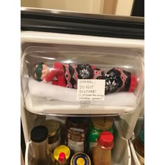 a refrigerator filled with lots of food and condiments on it's shelves