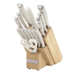 a knife block with many knives in it