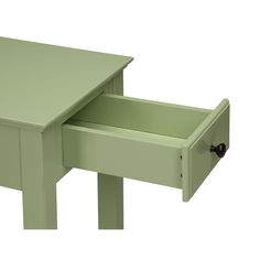 a small green table with one drawer open