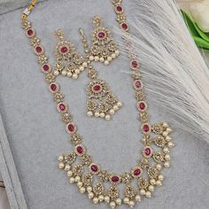 This Beautiful Antique Gold Polki Stone Long Mala Necklace Rani Haar Set for all Vibrant colors for your special events. Set Includes: Necklace, Tikka and Earrings Dimension necklace:- Length 10 inch Earrings:- Drop Length 2.5" Approximately. Jewellery Care -- Keep all the jewellery away from water, perfumes, and other harsh chemicals To clean wipe with a lint-free cloth to retain the shine Please Note- No Returns No Exchange Pink Bridal Necklace With Matching Earrings For Wedding, Pink Necklaces With Matching Earrings For Wedding, Elegant Bridal Sets For Marriage During Diwali, Pink Wedding Necklaces With Matching Earrings, Kundan Bridal Necklace With Matching Earrings For Wedding, Traditional Bridal Necklace With Matching Earrings For Wedding, Festive Bridal Necklace With Matching Earrings For Wedding, Festive Wedding Jewelry Sets With Matching Earrings, Festive Bridal Sets With Elegant Design For Party