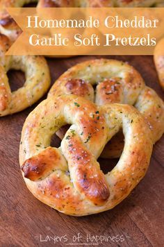 homemade cheddar garlic soft pretzels on a cutting board with text overlay