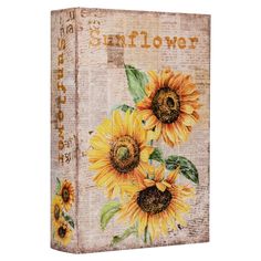 an old book with sunflowers painted on it