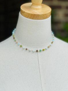 Enjoy the beauty of this handmade choker, featuring exquisite Peruvian opal stones. The chain showcases a stunning array of rich colors, from serene pale blues and aquas to vibrant greens and earthy tones. Measuring 16 inches in length with 2 " extension, this unique piece adds a touch of style to any outfit. Perfect for everyday wear or special occasions. Made with natural Peruvian Opal stones on gold over sterling silver wire. Dainty and lightweight. Natural stones may vary slightly in color. One Of A Kind Adjustable Choker Necklace, One-of-a-kind Adjustable Choker Necklace, Bohemian Hand-strung Amazonite Necklaces, Bohemian Single Strand Amazonite Jewelry, Bohemian Amazonite Single Strand Beaded Necklace, Bohemian Amazonite Single Strand Jewelry, Adjustable Beaded Amazonite Gemstone Necklace, Bohemian Opal Beaded Jewelry, Bohemian Chrysoprase Gemstone Bead Necklaces