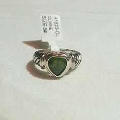 Green Heart Shaped Cubic Zirconia Ring. Available In Size 8. Elegant Green Heart Sterling Silver Ring, Elegant Green Sterling Silver Heart Ring, Heart-shaped May Birthstone Ring, Silver Heart-shaped May Birthstone Ring, Green Heart-shaped Sterling Silver Ring, Green Sterling Silver Heart-shaped Ring, Green Heart-shaped Jewelry For Promise, Green Heart-shaped Promise Jewelry, Sterling Silver Heart Rings With Emerald