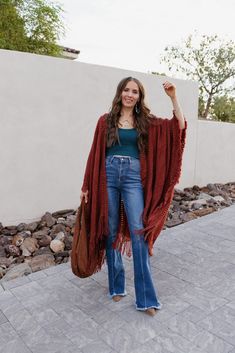 Women's Oversized Frayed Cardigan Open Bohemian Ruana Wrap yourself in playful bohemian vibes with our Open Bohemian Ruana. The oversized fit and frayed fringe detail add a touch of quirkiness to any outfit. Plus, it's one size fits all for easy and cute styling. Perfect for those who don't take fashion too seriously. (Wink!) Please note the next CUSTOM CUT WILL RESTOCK AND SHIP AROUND 12/6 FOR THE RUST. ALL OTHER COLORS IN STOCK READY TO SHIP! Details Available in size: One size Available in co Bohemian Long Sleeve Outerwear With Frayed Hem, Bohemian Outerwear With Frayed Hem For Festivals, Bohemian Outerwear With Frayed Hem For Spring, Oversized Bohemian Outerwear With Fringe, Bohemian Fall Outerwear With Tassels, Bohemian Fringe Outerwear For Fall, Fringe Outerwear For Fall Festival, Bohemian Winter Outerwear With Beaded Fringe, Oversized Tassel Outerwear For Fall