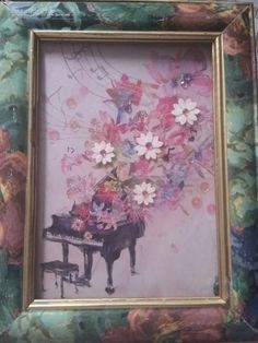 a painting with flowers on it and a piano in the foreground is an old - fashioned frame