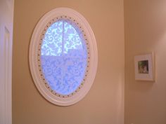 a round window in the corner of a room