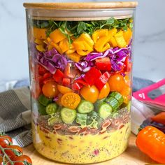 a jar filled with lots of different types of vegetables