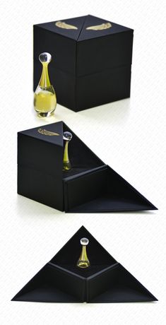 three different views of an empty bottle in a black box with gold trimmings