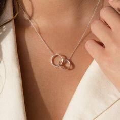 Give the perfect anniversary gift and commemorate the time you have spent together with our interlocking circle necklace. Personalize with engraving on each circle and give a sentimental present to that special someone. Material: High Quality Solid 925 Sterling Silver Finish: Sterling Silver ∙ 18K Gold ∙ Rose Gold SKU: MM-NM102F30 Necklace With Name On It, Double Circle Necklace, Custom Engraved Necklace, Art Deco Emerald Ring, Interlocking Circle Necklace, Circles Necklace, Gold Disc Necklace, Gold Circle Necklace, Karma Necklace