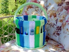 a crocheted basket sitting on top of a chair