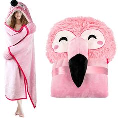 a woman wrapped in a pink towel next to a flamingo shaped bathrobe