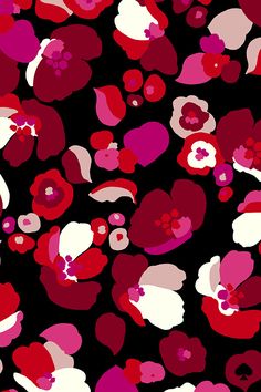 red and pink flowers on black background with white dots in the middle, all over