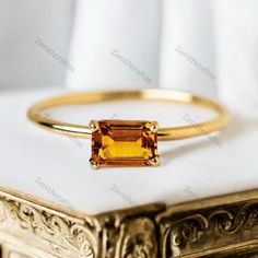 Emerald Cut Citrine Ring Vintage Style Gemstone Ring Yellow Gold Engagement Ring November Birthstone Jewelry Minimalist Jewelry Promise Gift Description: - Main Stone - Citrine Stone Creation - Lab Created  Stone Shape - Emerald Cut Stone Color - Yellow  Stone Size - 7 x 5 MM We Gladly Accept Customized Orders And Please Do Contact Us For Any Further Queries Regarding Your Order,  Feel Free To Contact Us 24 x 7 Customer Support Available  Rush Orders Available Gold Minimalist Topaz Promise Ring, Minimalist Gold Topaz Birthstone Ring, Minimalist Topaz Rings As Gifts, Minimalist Amber Ring Jewelry, Minimalist Gold Topaz Ring As Gift, Minimalist Gold Topaz Ring Gift, Minimalist Citrine Rings For Anniversary, Minimalist Citrine Gemstone Ring, Minimalist Gold Solitaire Topaz Ring