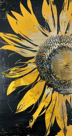 a large yellow sunflower painted on a black background