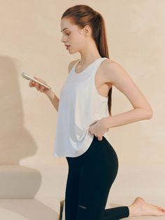 Relaxed-fit sports tank top. Low-cut, round neckline, and racer back.- Regular length- Sleeveless- Relaxed fit- Racer back Moisture-wicking Sleeveless Tank Top, Summer Sleeveless Muscle Tee For Light Sports, Athleisure Tank Top With Built-in Bra, Summer Tank Top With Built-in Bra For Light Exercise, Functional Scoop Neck Tank Top For Yoga, Functional Sleeveless Tank Top With Built-in Bra, Functional Sleeveless Top With Built-in Bra, Sleeveless Yoga Tank Top Sportswear, Racerback Tank Top With Built-in Bra For Light Exercise