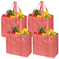 three bags filled with fruits and vegetables on top of each other in front of a white background