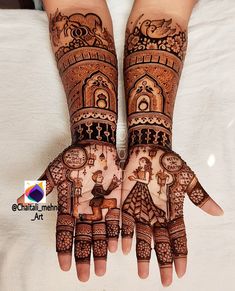 two hands with henna designs on them