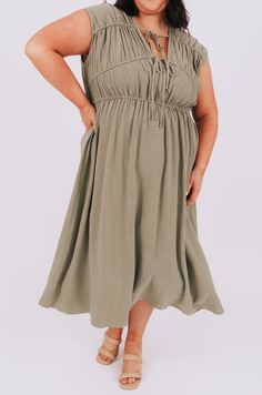 Unleash your inner joy with the PLUS SIZE Jades Of Joy Dress! This dress features playful ruching and tie front closures, adding an extra touch of fun to your outfit. Perfect for any occasion, this dress will have you feeling confident and stylish. Details Ruching Tie front closures Sizing Approximate measurements: SIZE LENGTH BUST 1XL 50"﻿ 42"﻿ 2XL 52"﻿ 44"﻿ 3XL 54"﻿ 46"﻿ Fabric has no stretch - elastic in the bodice allows for stretch*Model is 5’8 wearing 2XL Material 80% Rayon 20% LinenHand w Spring Beach Dress With Drawstring Tie, Spring Knee-length Drawstring Midi Dress, Spring Knee-length Midi Dress With Drawstring, Midi Length Drawstring Dress For Day Out, Spring Dresses With Drawstring Tie For Daywear, Casual Tied Dresses For Spring, Casual Spring Dress With Tied Details, Summer Knee-length Midi Dress With Drawstring, Casual Summer Dresses With Tied Details