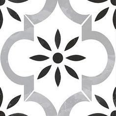 a white and black tile with an abstract design