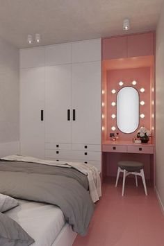 a bedroom with pink and white walls and furniture