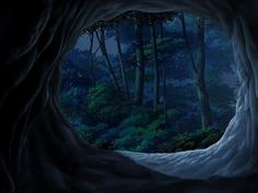 the inside of a cave with trees and bushes