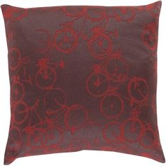 a red pillow with bicycles on it