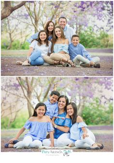 the family is posing for a photo in front of some trees and purple flowers with their arms around each other