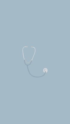 a medical stethoscope hanging from the side of a blue wall with no one in it