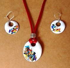 the necklace and earring are decorated with cartoon characters