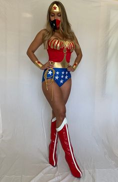 a woman in a costume is posing for a photo while wearing red, white and blue boots