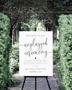 an outdoor wedding ceremony sign with the words unplugged ceremony written on it