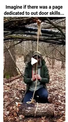 a woman sitting on top of a log in the woods holding a rope with her hands