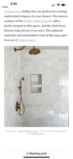 a bathroom with white tile and gold fixtures on the shower head, in an article about remodeling