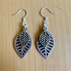 Nature is always in style when you've got these layered leaves on your lobes.  - 2" long - Nickel free ear wires - silver plated charms - comfortable for all day wear. Find more of my earrings here: https://www.etsy.com/shop/fatcatbeads?section_id=42122010 Thank you for shopping with me! View all of my items here: www.fatcatbeads.etsy.com Nickel-free Leaf-shaped Nature-inspired Earrings, Nickel-free Leaf-shaped Sterling Silver Earrings, Nickel-free Metal Leaf Earrings, Nature-inspired Hypoallergenic Leaf Earrings, Nickel Free Leaf-shaped Metal Earrings, Nickel-free Leaf-shaped Metal Earrings, Nickel-free Metal Leaf-shaped Earrings, Hypoallergenic Leaf-shaped Earrings, Silver Leaf-shaped Metal Earrings