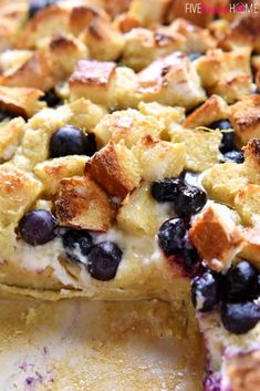 a close up of a pie with blueberries and bread crumbs on it