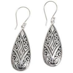 The teardrop shape of these dangle earrings is the perfect canvas for showcasing floral and diamond motifs typical of Balinese silver work. Created by Balinese artisan Made Sudiari these earrings feature designs on both sides with some open space between motifs and also darker oxidized areas that bring out the intricacies of the design. Traditional Teardrop Earrings As A Gift, Traditional Teardrop Earrings For Gift, Ornate Teardrop Earrings As Gift, Classic Teardrop Earrings With Intricate Design, Traditional Nickel-free Drop Earrings, Traditional Silver Teardrop Pierced Earrings, Sterling Silver Intricate Teardrop Earrings, Sterling Silver Teardrop Earrings With Intricate Design, Traditional Nickel-free Teardrop Earrings