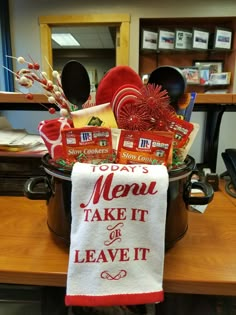 a kitchen towel that says, today's menu take it or leave it on top of a pot