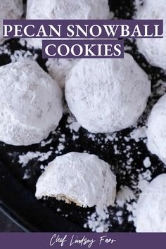 a pan filled with powdered snowball cookies