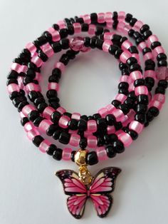 Waist beads made with 4mm black and matte hot pink glass seed beads, 6mm Czech glass beads, and enamel 'butterfly' charm. Beads are on sturdy elastic cord. Spiritual Pink Spacer Beads, Pink Spiritual Beaded Bracelets With Tiny Beads, Pink Jewelry With Adjustable Black Beads, Pink Spacer Beads For Gifts, Adjustable Pink Beaded Necklaces With Black Beads, Adjustable Pink Beaded Necklace With Black Beads, Adjustable Pink And Black Beaded Necklaces, Adjustable Pink Beaded Necklace With 108 Beads, Pink Jewelry With Black Beads For Gift